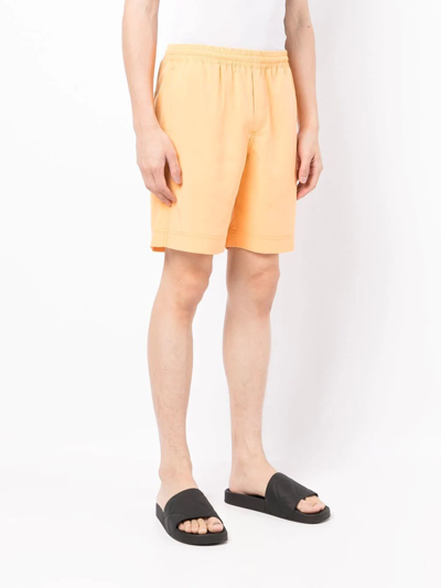 Shop Msgm Elasticated Deck Shorts In 橘色