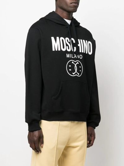 Shop Moschino Logo Drawstring Hoodie In Black