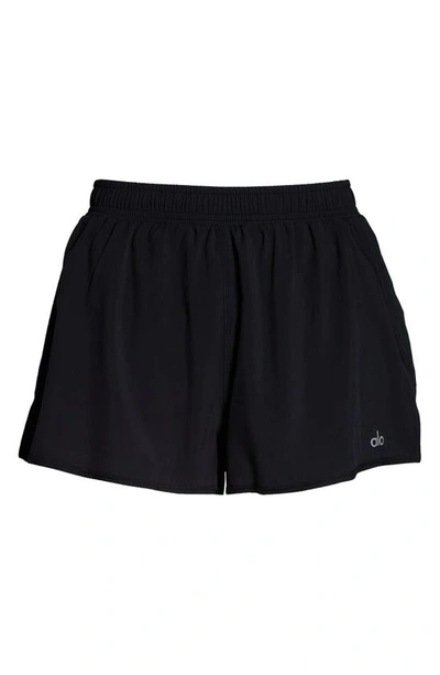 Shop Alo Yoga Stride Shorts In Black