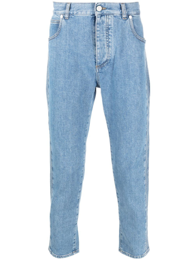Shop Balmain Embossed-logo Slim-cut Cropped Jeans In Blue