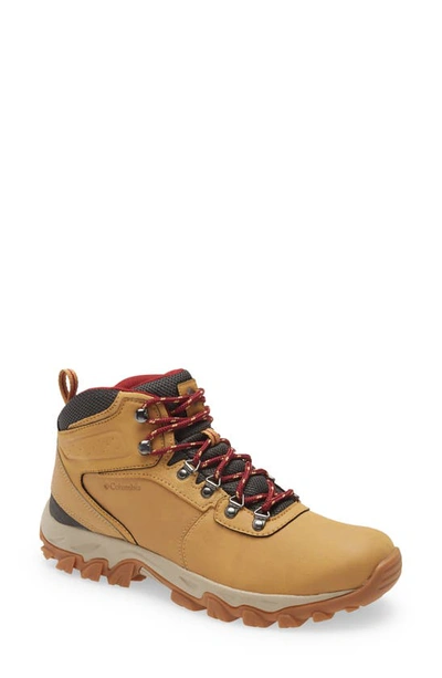 Shop Columbia Newton Ridge™ Plus Ii Waterproof Hiking Boot In Yellow Red