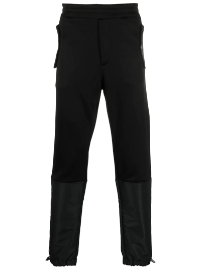 Shop Alexander Mcqueen Panelled Tapered Track Pants In Black