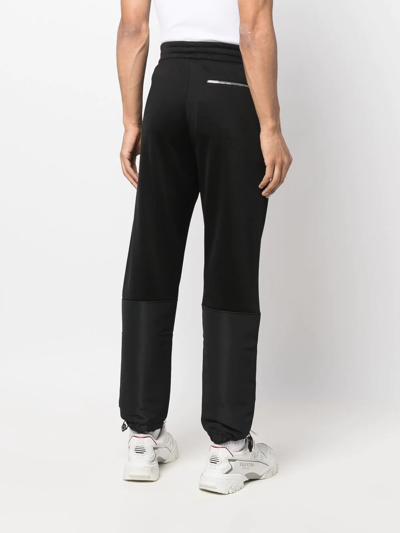 Alexander Mcqueen Panelled Tapered Track Pants In Black