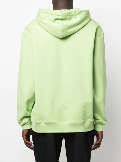 Shop Moschino Graphic Print Drawstring Hoodie In Green