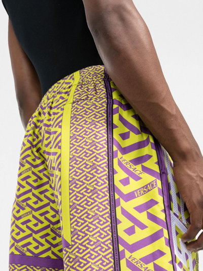 Versace La Greca-print Silk Shorts In Yellow