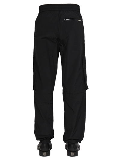 Shop Balmain Logo Cargo Pants In Black
