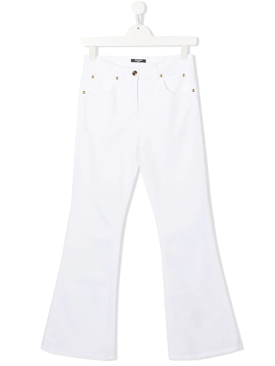Shop Balmain Mid-rise Flared-leg Jeans In White