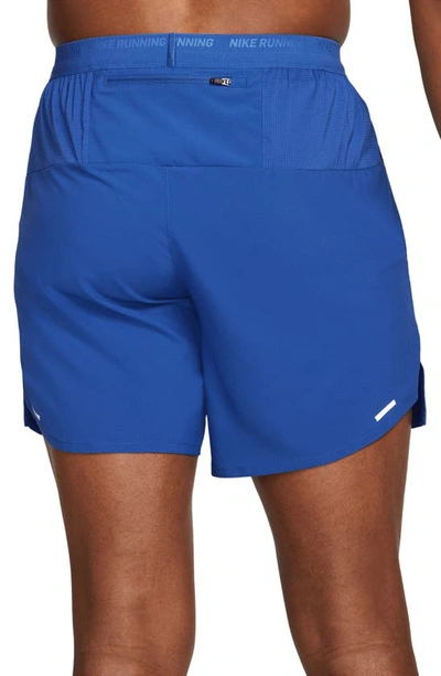 Shop Nike Dri-fit Stride Unlined Running Shorts In Game Royal/ Black