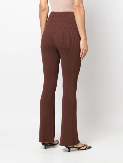 Shop Aeron Ribbed-knit Flared Trousers In Brown