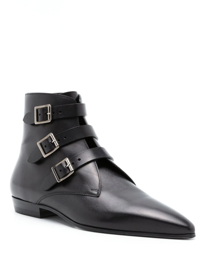 Shop Saint Laurent Goth Leather Buckle Boots In Black