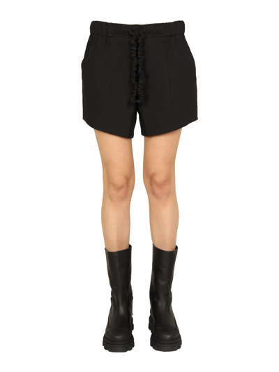 Shop Ganni Ruffled Elastic Shorts In Black