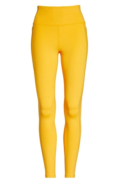 Shop Girlfriend Collective High Waist Pocket Leggings In Golden Glow