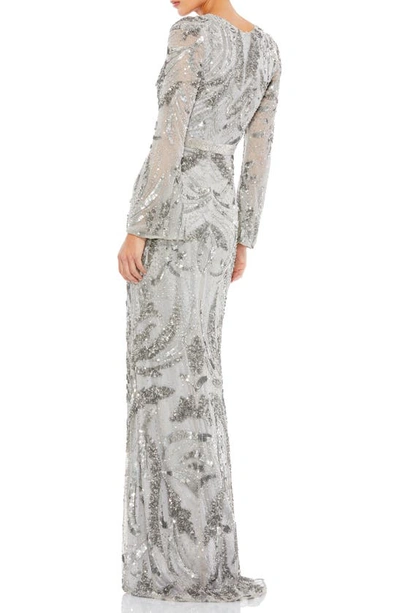 Shop Mac Duggal Swirl Sequin Long Sleeve Faux Wrap Gown In Platinum