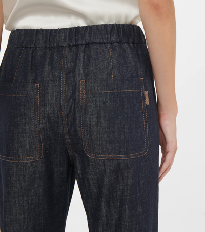 Shop Brunello Cucinelli Embellished Tapered Jeans In Denim