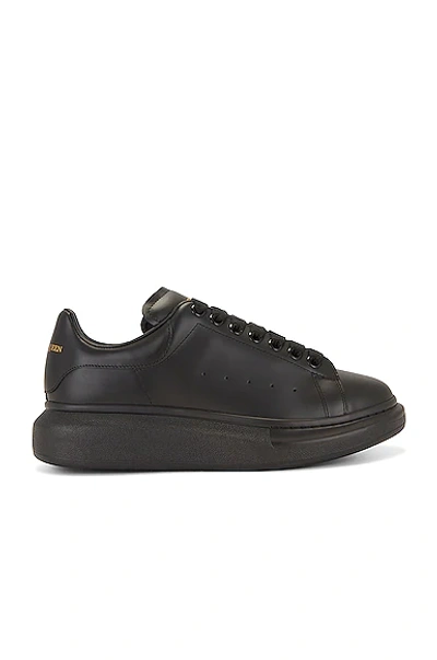 Alexander Mcqueen Black Sneakers With Logo Lettering On The Rear And Oversize Rubber Sole In Leather In Black