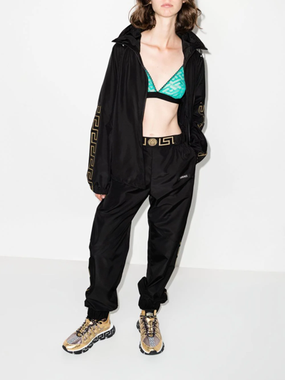 Shop Versace Logo-print Track Pants In Schwarz