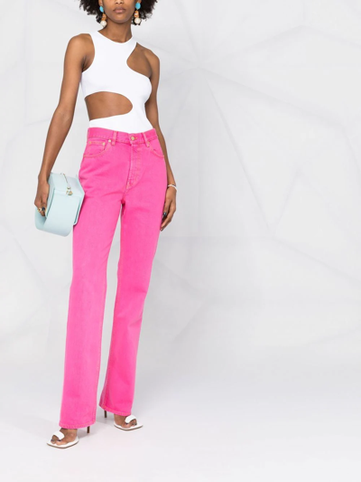 Shop Jacquemus Nîmes Flared Jeans In Pink