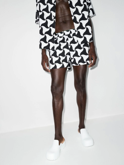 Shop Bottega Veneta Abstract-print Swim Shorts In Schwarz