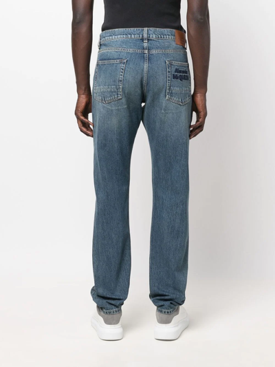 Shop Alexander Mcqueen Logo-embroidered Straight-leg Jeans In Blue