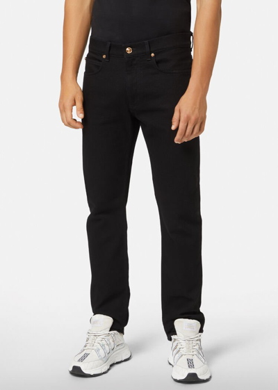 Shop Versace Slim-fit Jeans In Black
