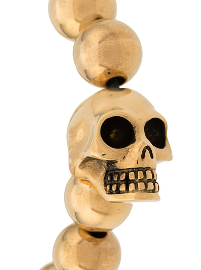 Shop Alexander Mcqueen Mans Golden Brass Skull Bracelet In Metallic