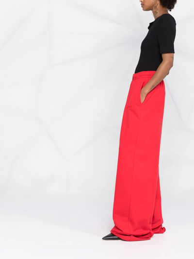 Shop Vetements Wide-leg Track Pants In Red