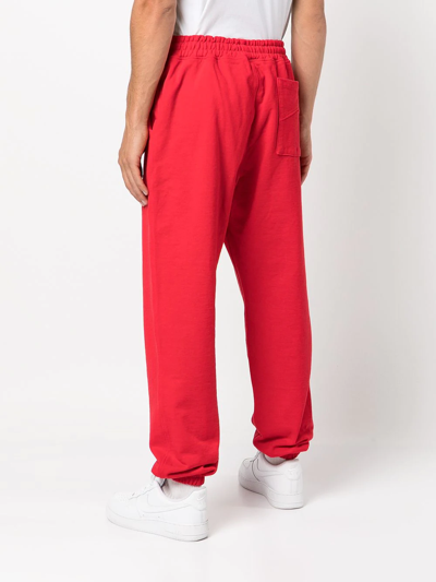 Rhude Embroidered-logo Tapered Joggers In Red