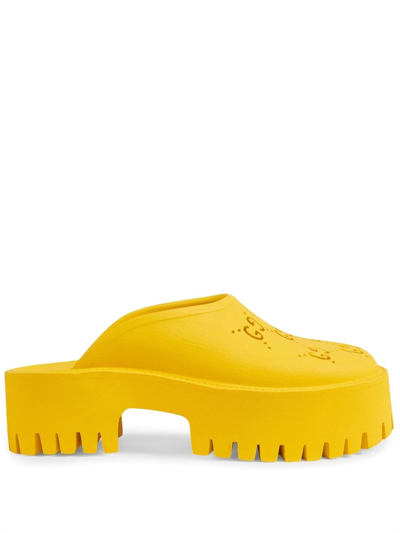 Shop Gucci Perforated Gg Platform Mules In Yellow