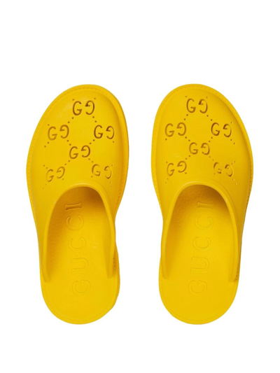 Shop Gucci Perforated Gg Platform Mules In Yellow