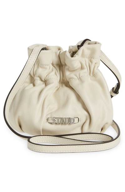 Shop Staud Mini Grace Bucket Crossbody Bag In Cream