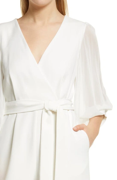 Shop Donna Ricco Long Sleeve Wrap Jumpsuit In Ivory