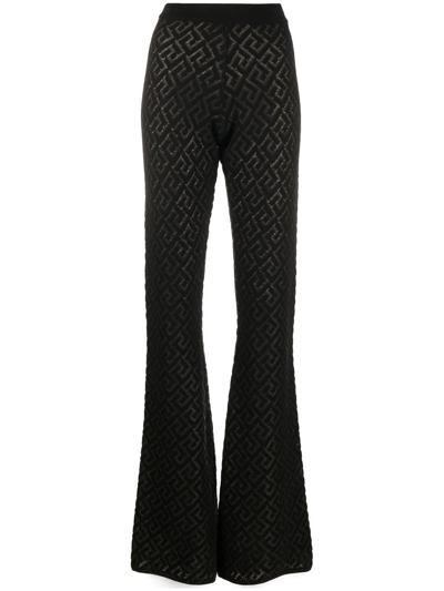 Shop Versace La Greca Knit Trousers In Black