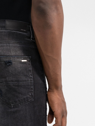 Shop Amiri Ripped Skinny-fit Jeans In Schwarz
