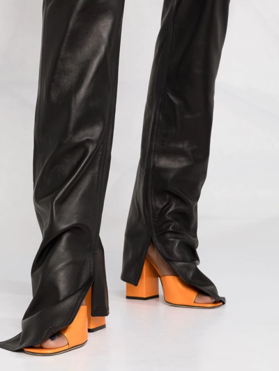 Shop Attico Split-cuff Leather Trousers In Schwarz