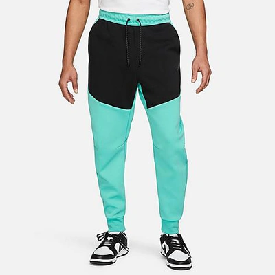 Shop Nike Tech Fleece Taped Jogger Pants In Washed Teal/black/black