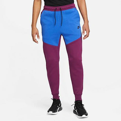 Shop Nike Tech Fleece Taped Jogger Pants In Sangria/game Royal/black