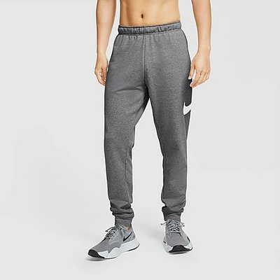 Shop Nike Men's Dri-fit Futura Swoosh Tapered Jogger Pants In Charcoal Heather/white