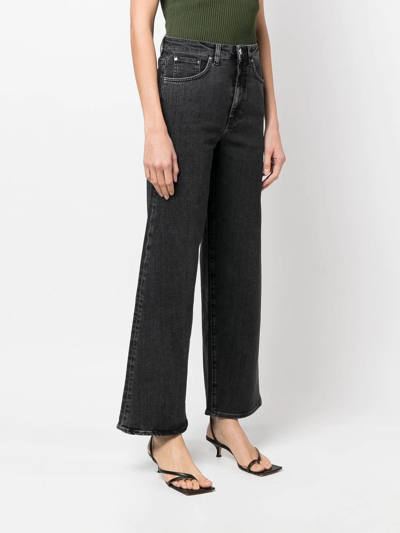 Shop Totême High-waist Flared Jeans In Grey