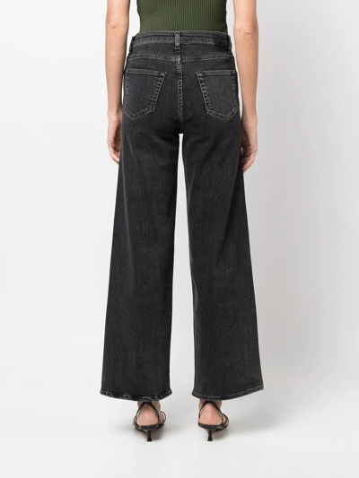 Shop Totême High-waist Flared Jeans In Grey