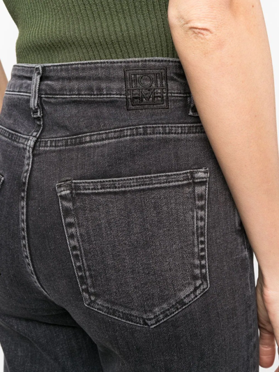 Shop Totême High-waist Flared Jeans In Grey