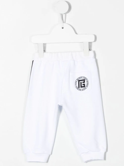 Shop Balmain Side-stripe Track Pants In White