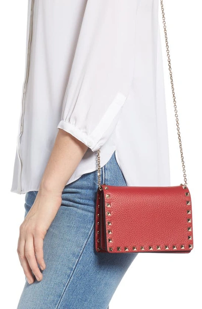 Shop Valentino Rockstud Leather Pouch Wallet On A Chain In Rouge Pur