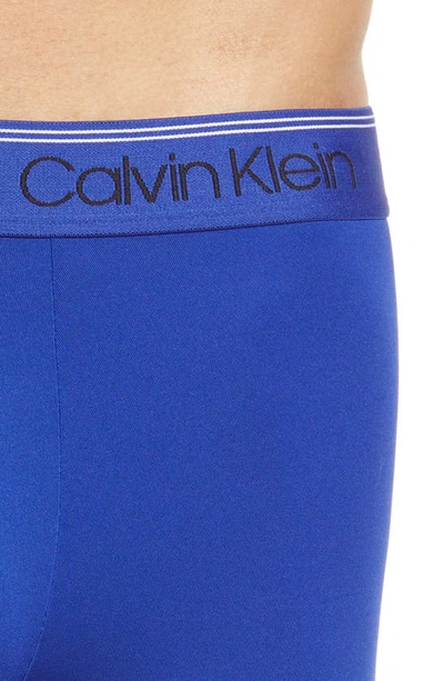 Shop Calvin Klein 3-pack Low Rise Microfiber Stretch Trunks In Work Blue/ Flame/ Olive