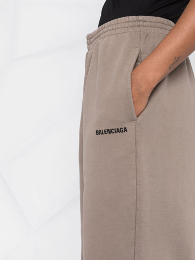 Shop Balenciaga Logo-embroidered Cotton Jogging Pants In Brown