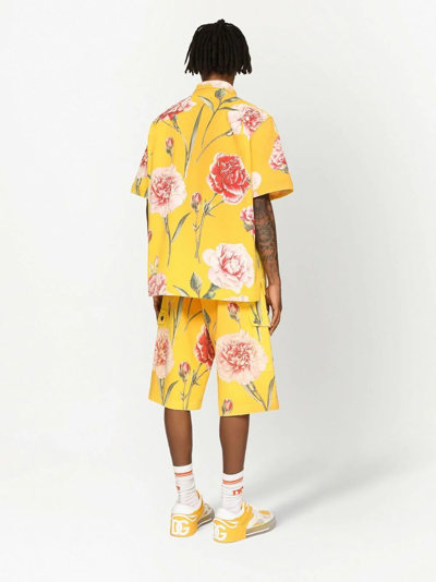 Shop Dolce & Gabbana Carnation-print Denim Shorts In Yellow