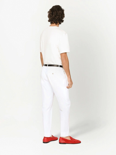 Shop Dolce & Gabbana Tapered Cotton Trousers In White