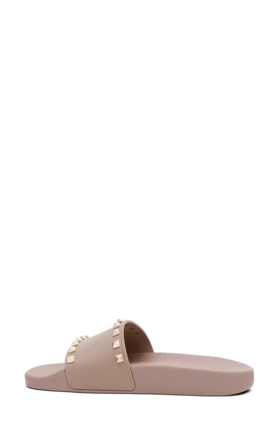 Shop Valentino Rockstud Slide Sandal In Poudre