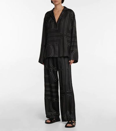 Shop Totême Logo Wide-leg Silk Pants In Black Monogram