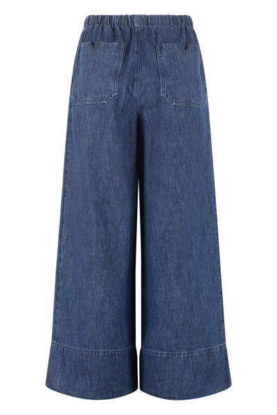 Shop Valentino Wide-cut Jeans In Denim