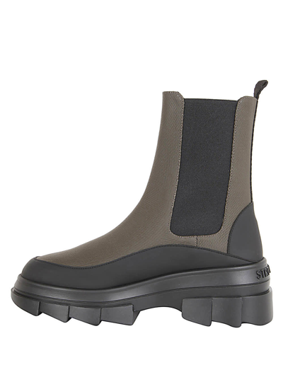 Stuart Weitzman Chelsea Boots With Lug Sole And Pull Tab In Lvx Military Black